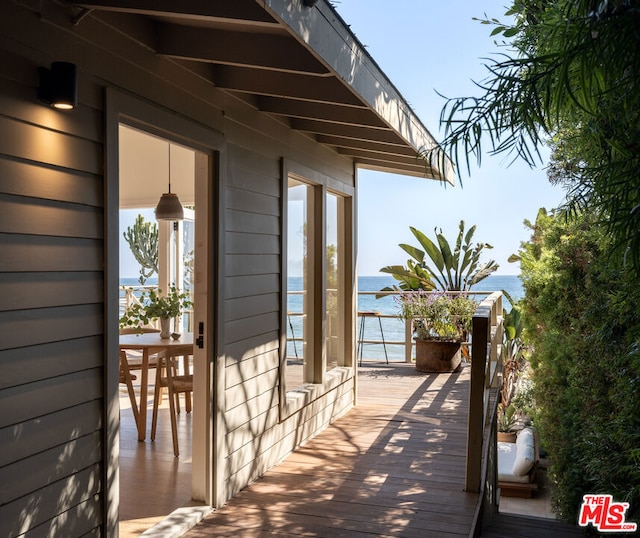 wooden terrace with a water view