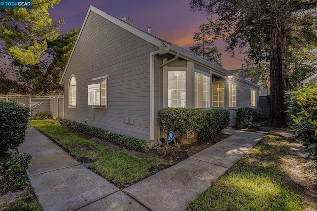 view of property exterior at dusk