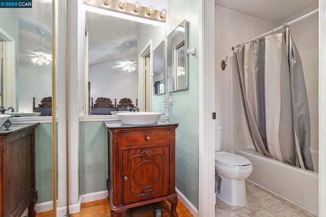 full bathroom with vanity, shower / bath combination with curtain, ceiling fan, and toilet