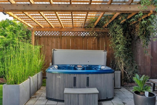 view of patio / terrace with a pergola and a hot tub