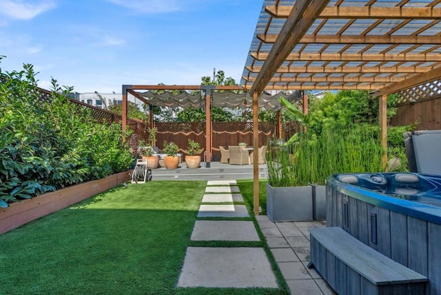 view of yard featuring a pergola, a hot tub, and a patio area