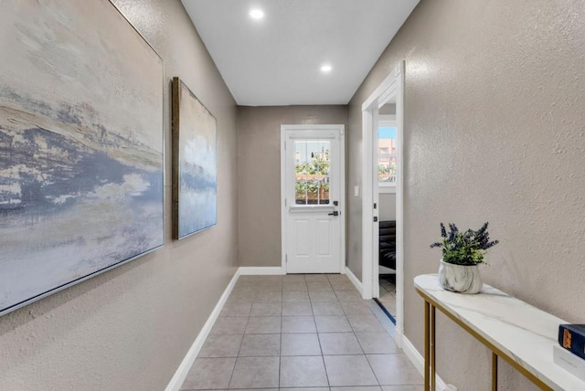 entryway with light tile patterned floors