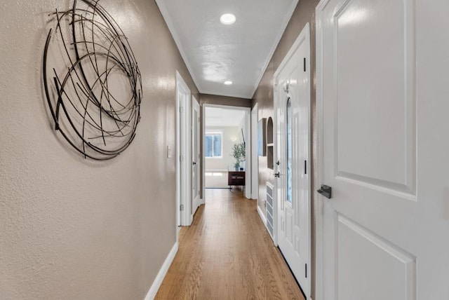 hall with light hardwood / wood-style floors