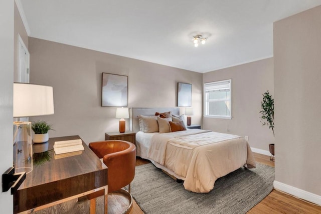 bedroom with wood-type flooring