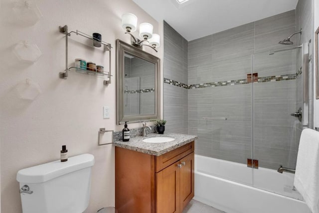 full bathroom with vanity, toilet, and tiled shower / bath