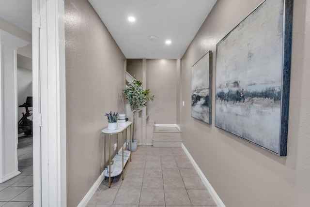 corridor with light tile patterned floors