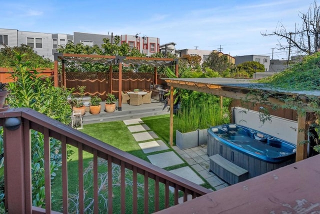 wooden balcony featuring a deck, a pergola, and a hot tub