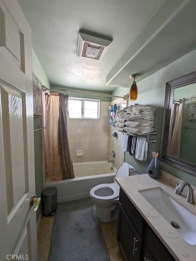 full bathroom featuring tile patterned floors, vanity, shower / tub combo, and toilet