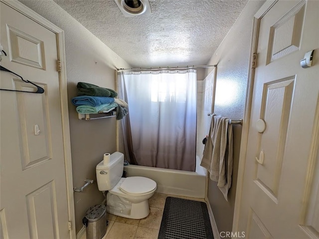 bathroom featuring a textured ceiling, tile patterned flooring, shower / tub combo, and toilet