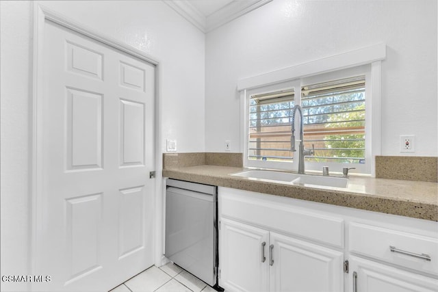 kitchen featuring white cabinets, crown molding, sink, dishwasher, and light tile patterned flooring