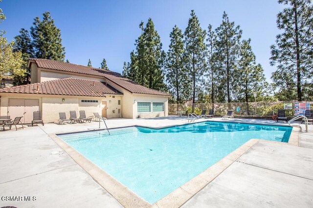 view of pool featuring a patio area