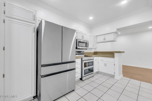 kitchen with white cabinetry, stainless steel appliances, and light tile patterned floors