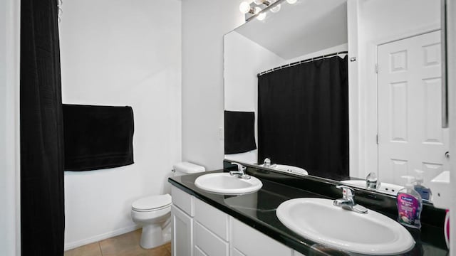 bathroom with tile patterned flooring, vanity, toilet, and a shower with shower curtain