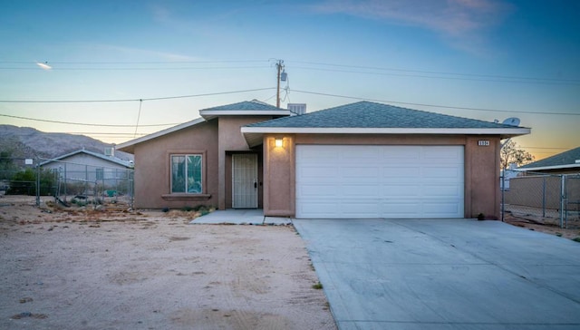 single story home featuring a garage