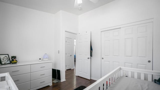 bedroom with ceiling fan, dark hardwood / wood-style flooring, and a closet