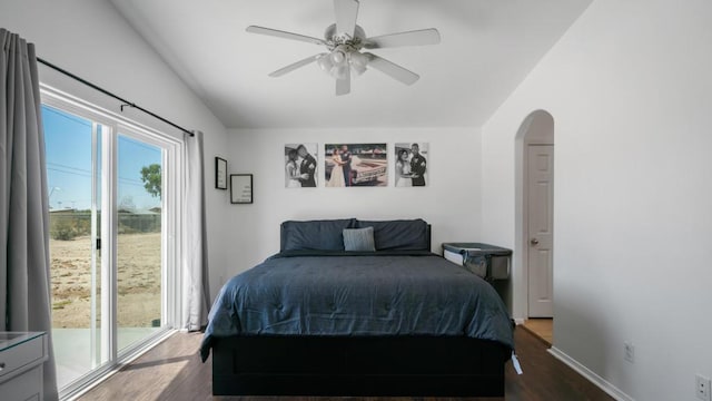 bedroom featuring dark hardwood / wood-style flooring, ceiling fan, and lofted ceiling