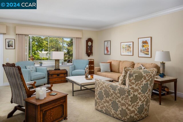 carpeted living room featuring ornamental molding