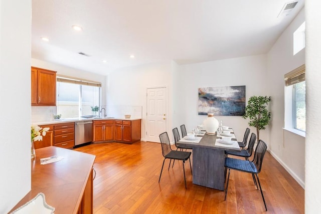 dining space featuring light wood-type flooring