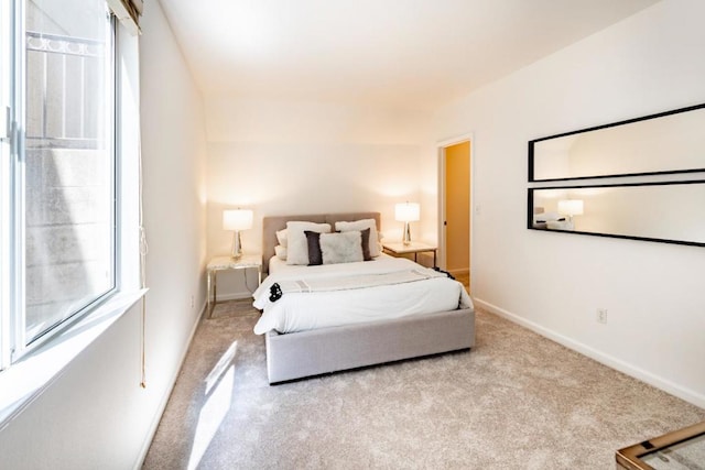 bedroom with light colored carpet