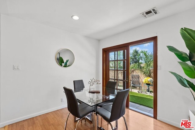 dining area with hardwood / wood-style flooring