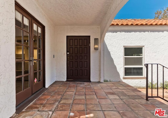 doorway to property with french doors