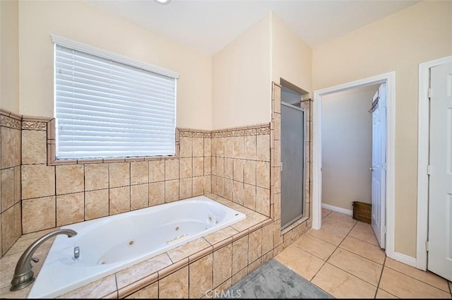 bathroom featuring tile patterned floors and independent shower and bath