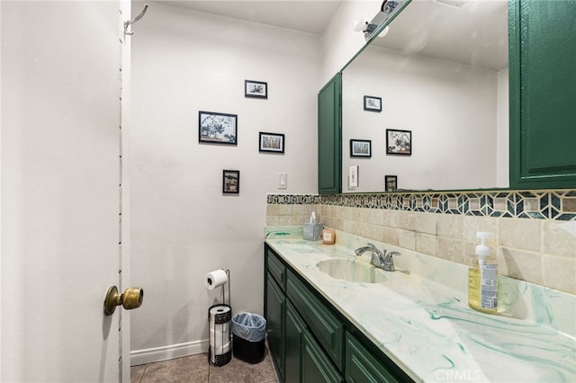 bathroom featuring vanity, tasteful backsplash, and tile patterned floors