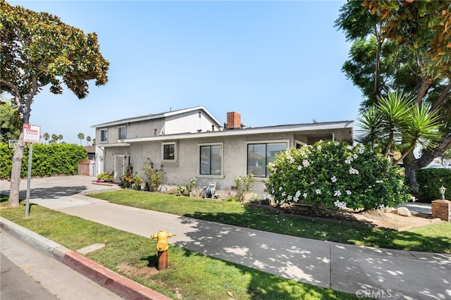 view of front of home with a front yard