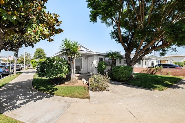 view of front of home with a front lawn