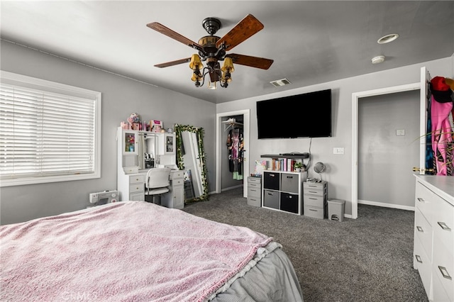 carpeted bedroom with a closet and ceiling fan