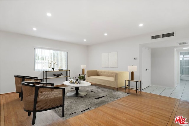 living room featuring a healthy amount of sunlight and light wood-type flooring