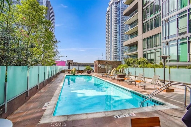 view of swimming pool featuring a patio area