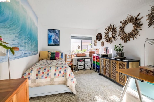 bedroom with light colored carpet