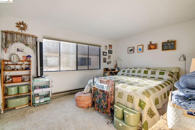 bedroom with carpet floors and a baseboard radiator