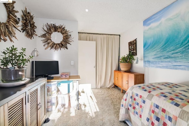 carpeted bedroom with a textured ceiling