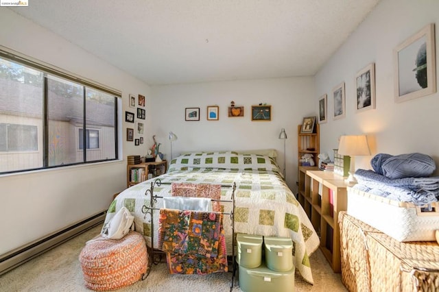 bedroom with a baseboard radiator and carpet floors