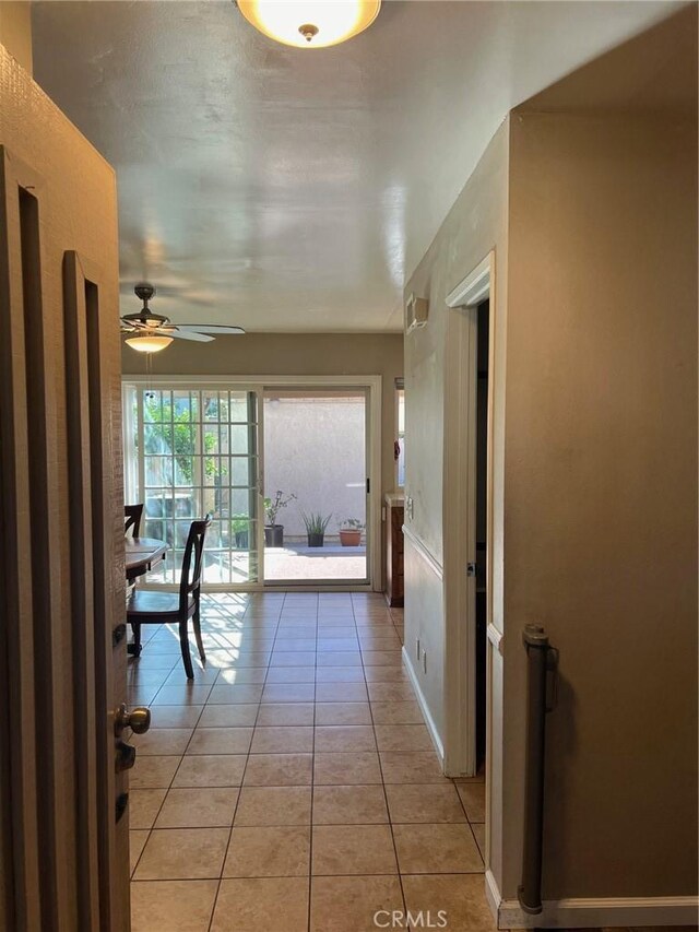 corridor with light tile patterned flooring