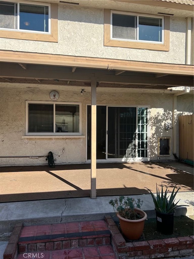 property entrance featuring a patio