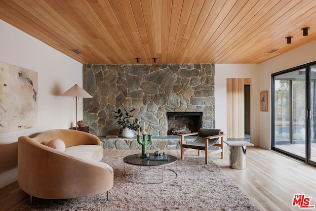 living room featuring a fireplace, wood ceiling, and hardwood / wood-style flooring