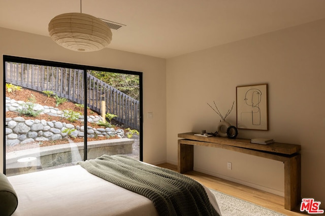 bedroom featuring light wood-type flooring