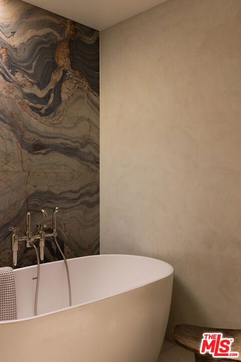 bathroom featuring a tub to relax in