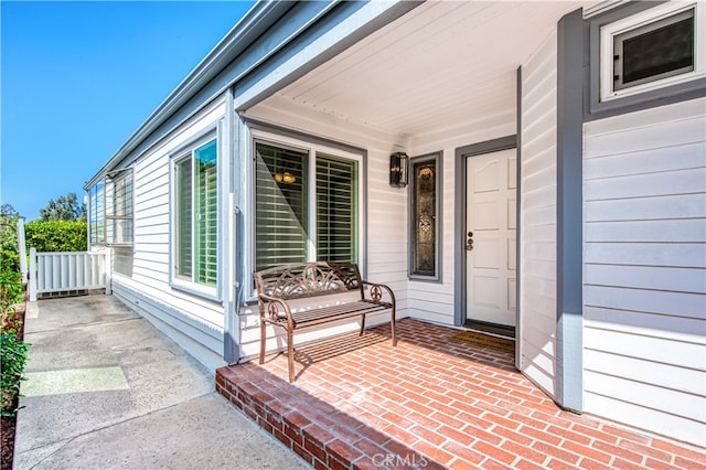 property entrance featuring covered porch