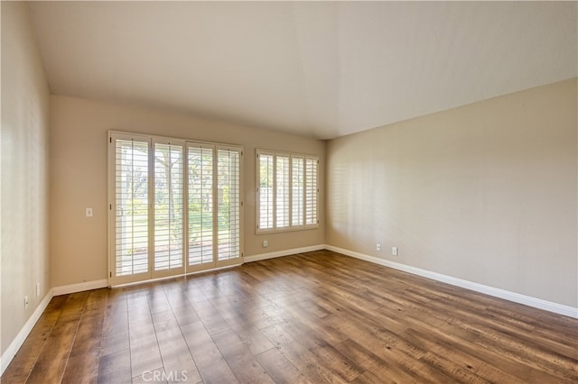 unfurnished room featuring dark hardwood / wood-style flooring