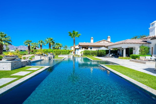 view of pool featuring a patio area