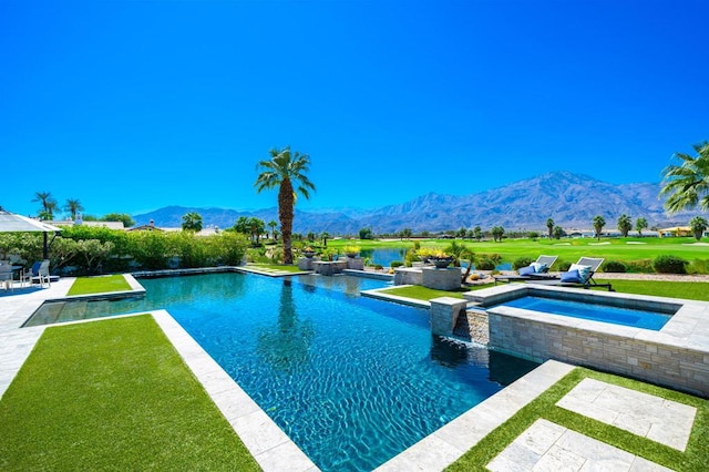 view of swimming pool featuring a lawn, a patio area, an in ground hot tub, and a mountain view