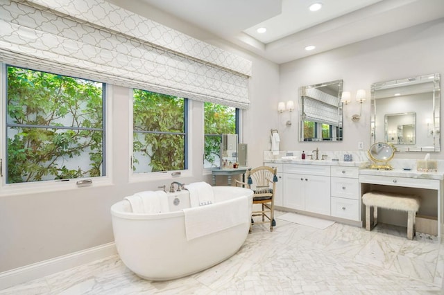 bathroom with a bathtub and vanity