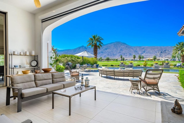 view of patio with a mountain view and an outdoor hangout area