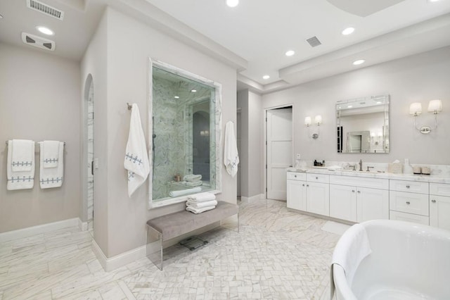 bathroom featuring shower with separate bathtub and vanity