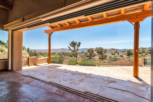 view of patio / terrace with a mountain view