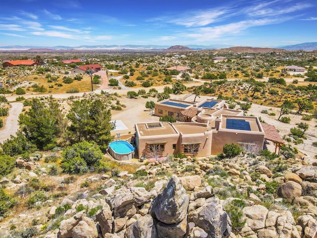 birds eye view of property featuring a mountain view